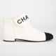 Chanel  Buty kremowo-czarne botki z logo na przodzie
