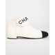 Chanel  Buty kremowo-czarne botki z logo na przodzie